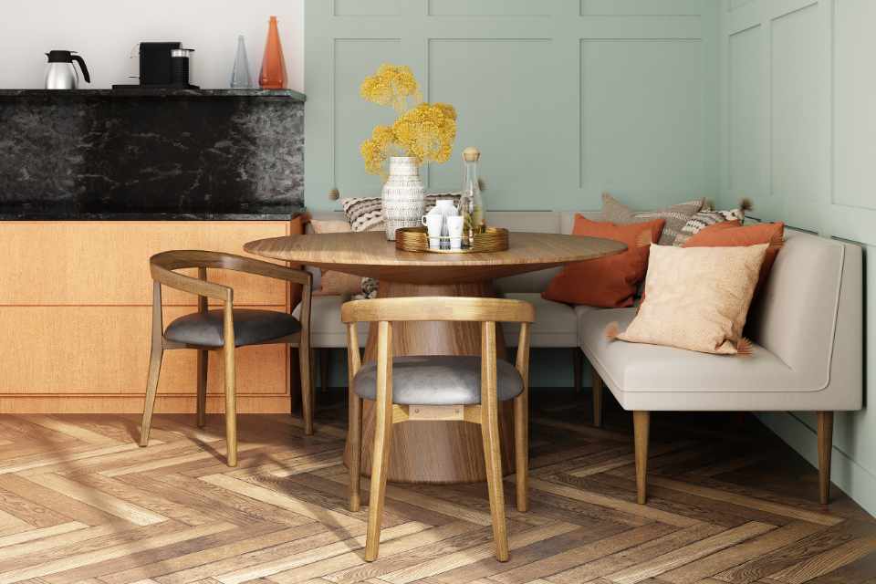 herringbone hardwood floor in breakfast nook with seafoam green accent wall